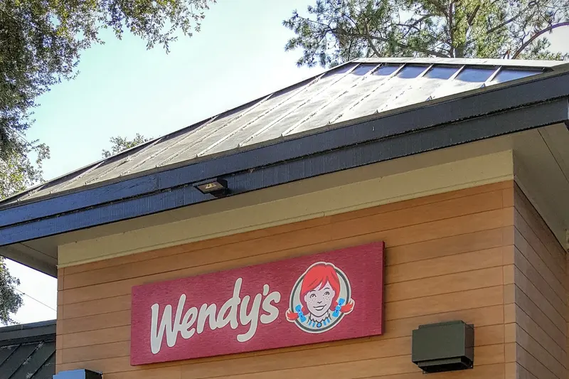 The Wendy’s sign on the front of the restaurant