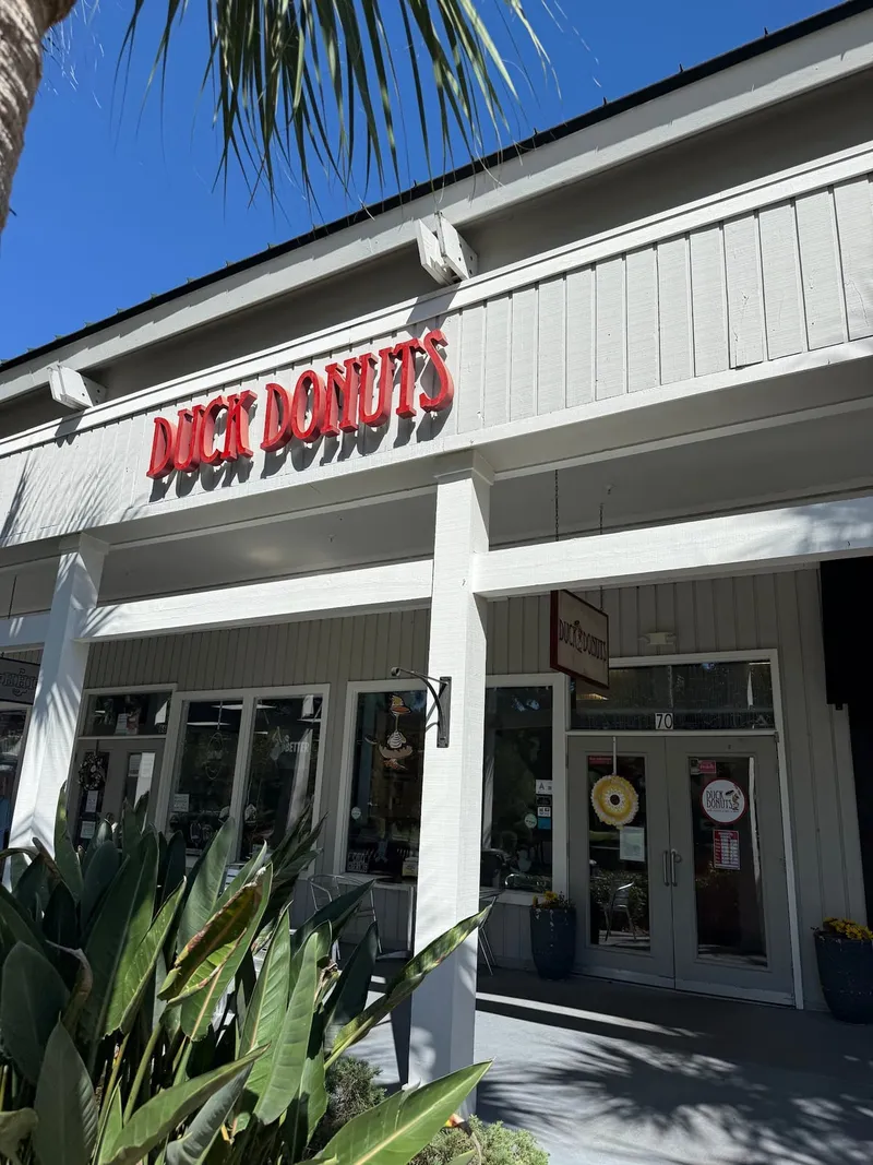 The Duck Donuts sign over the shop entrance on William Hilton Parkway