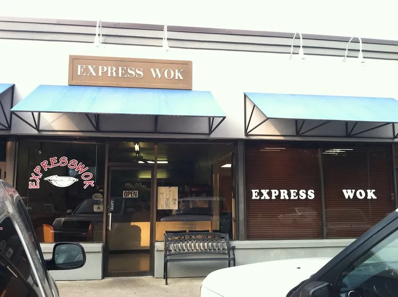 The Express Wok storefront with its blue awnings, wooden sign and window lettering