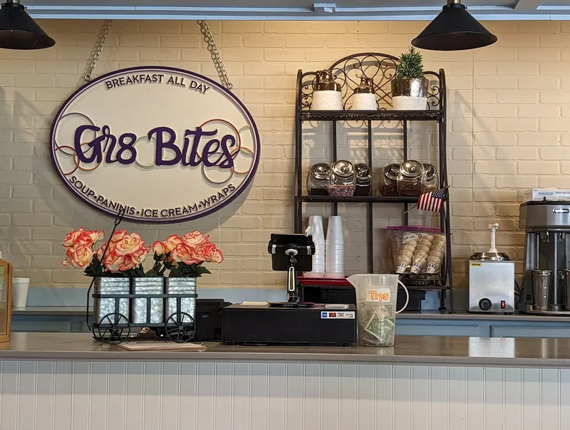 The Gr8 Bites sign above the order counter, reading breakfast all day, soup, paninis, ice cream and wraps