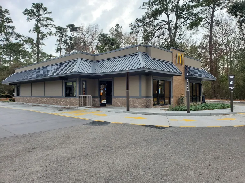 The McDonald's restaurant building and drive-thru lane on Plaza Drive