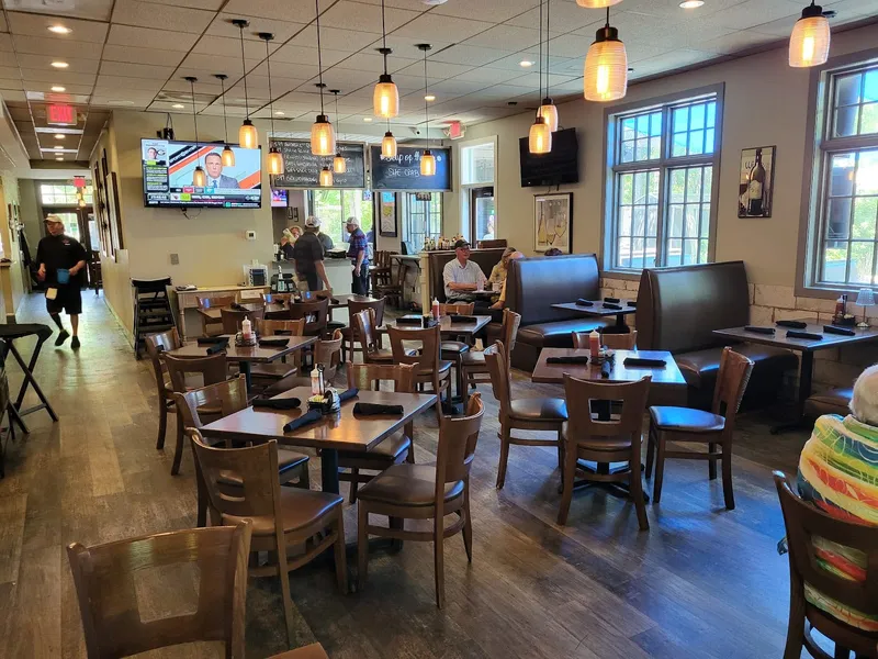 The dining room at Mixx On Main, with tables, booths and windows along the side