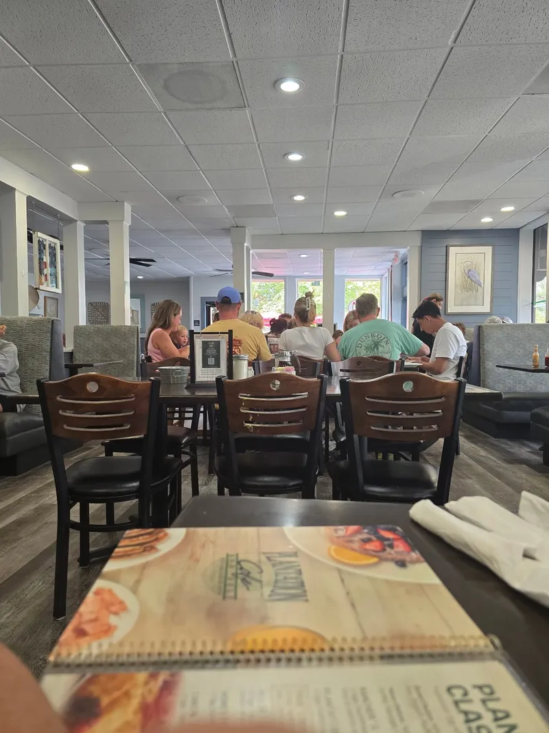 Diners at tables in the dining room at Plantation Cafe on Pope Avenue