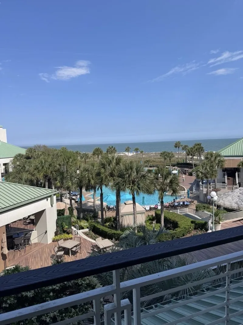 The view from the VIEW 32 deck at the Westin, looking over the resort courtyard and pool toward the ocean