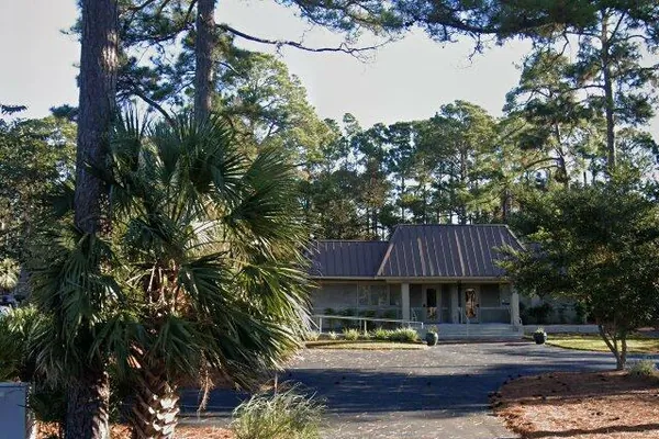 The Keith Funeral and Cremation Services building among the pines on Arrow Road
