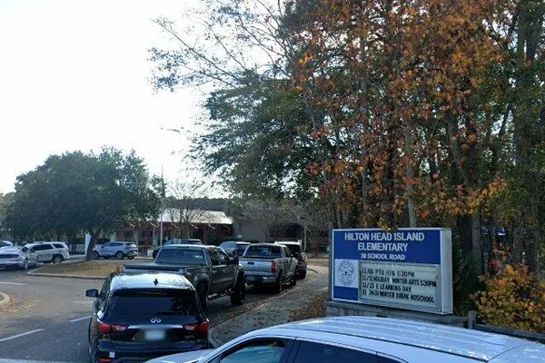 The Hilton Head Island Elementary sign on School Road, beside the school parking lot
