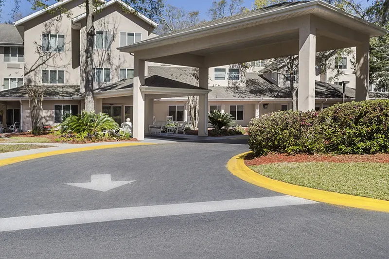 The covered entrance drive at Holiday Indigo Pines on Gardner Drive