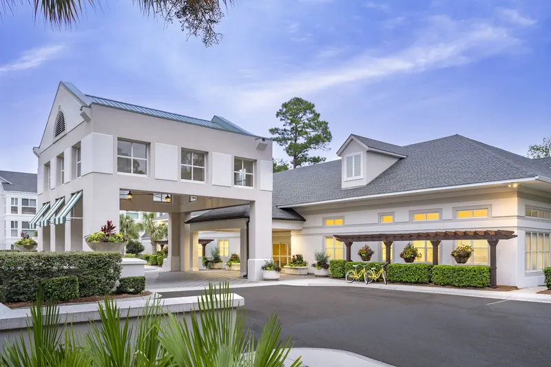The white entrance building and porte-cochère at TidePointe