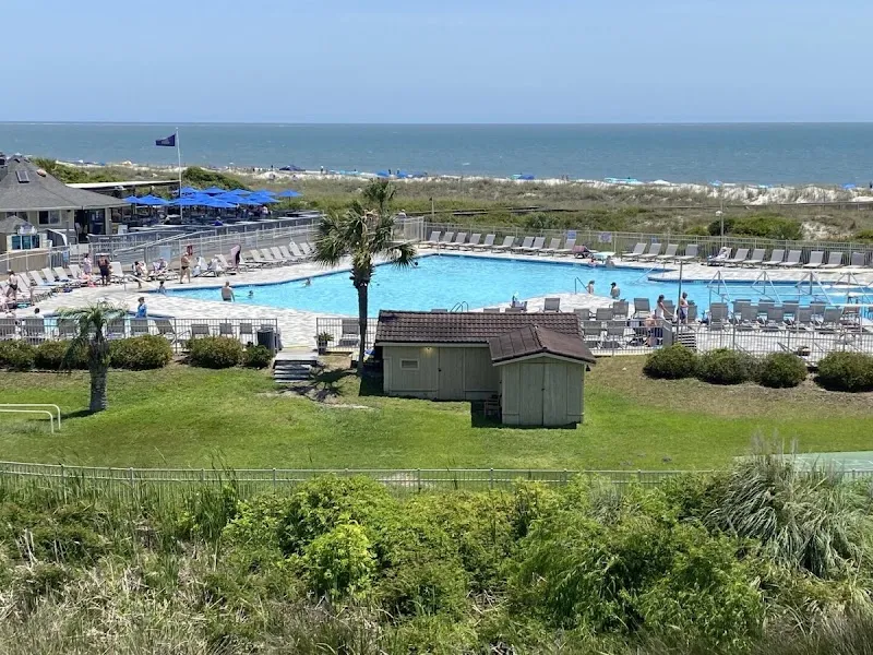 The oceanfront pool area and beach at the Hilton Head Island Beach & Tennis Resort on Folly Field Beach