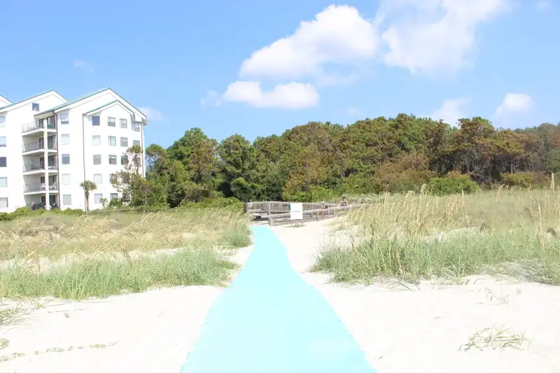 A blue beach mat leading over the dunes at Folly Field Beach Park, Hilton Head Island