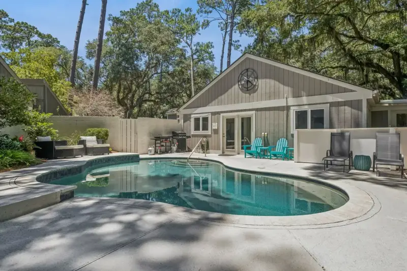 A Hilton Head vacation home with a private pool under live oaks