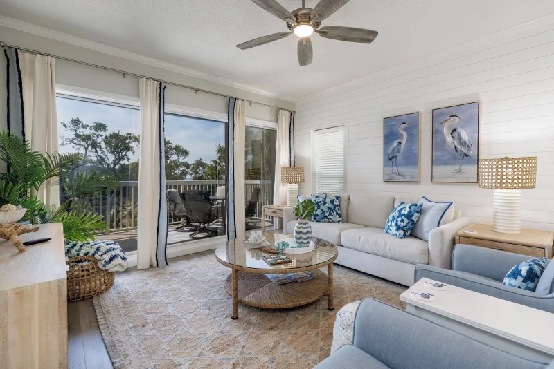 Living room with a balcony in a Barrington Arms villa