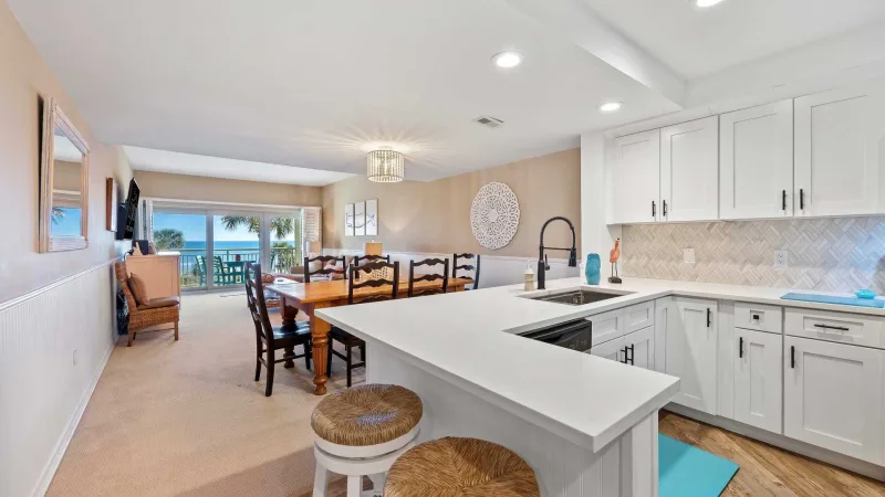 Open living area with a view of the ocean in a Beach Villas unit