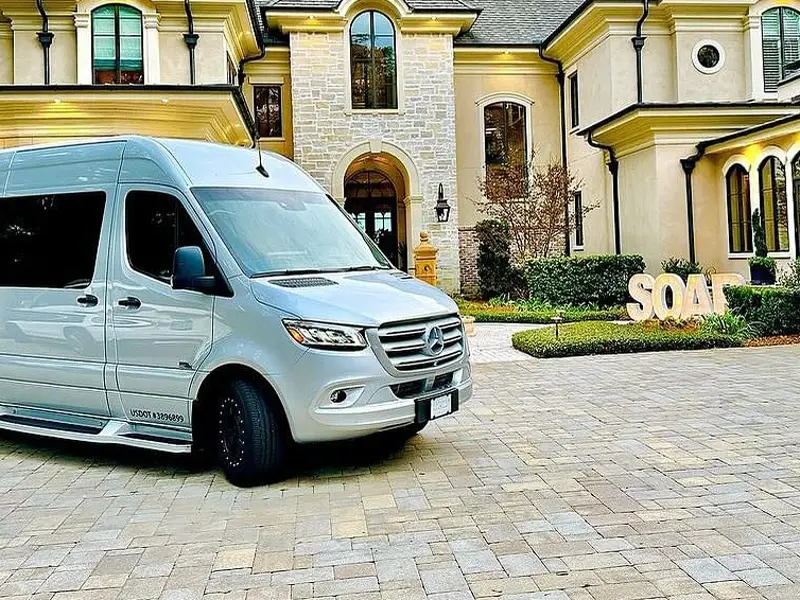 A silver Mercedes Sprinter executive van from Platinum Executive Coaches