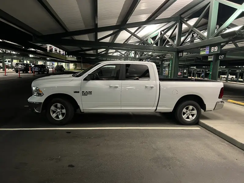 A white pickup truck rental in the Savannah airport rental garage