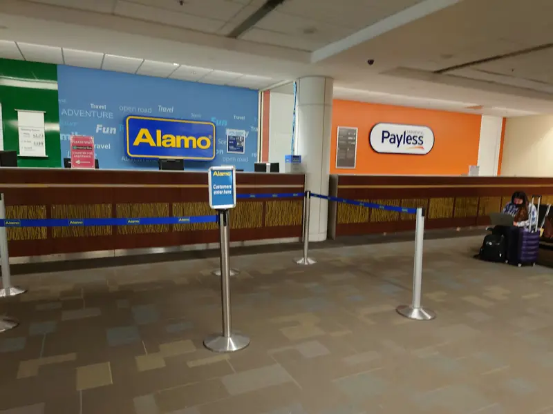 The Payless counter beside Alamo in baggage claim at the Savannah airport
