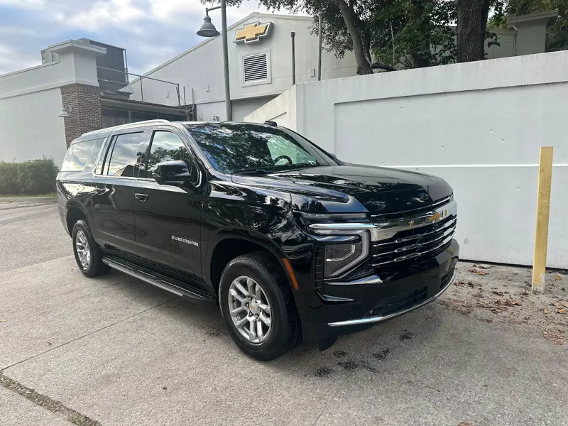 A black Chevrolet Suburban from White Sands Transportation