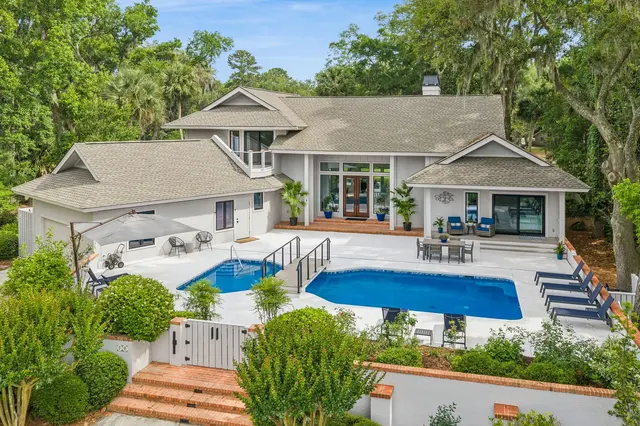 Pool and back of the house of this home in Sea Pines