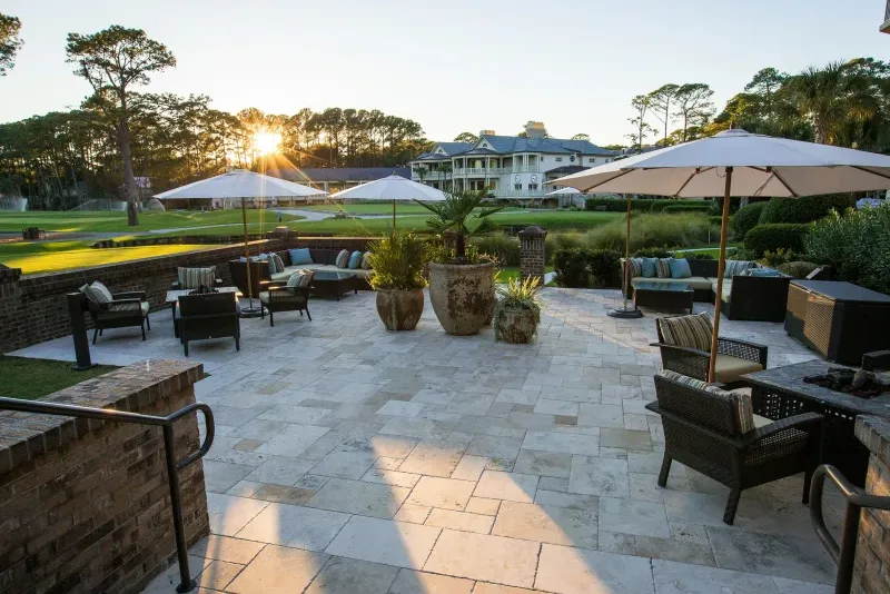 Outdoor terrace at The Inn & Club at Harbour Town, overlooking the golf course at sunrise