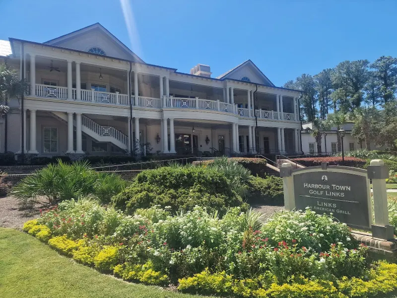 The Harbour Town Clubhouse, home of Links, an American Grill, with its double porches and the clubhouse sign in front