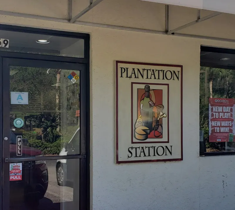 The Plantation Station sign beside the shop’s front door at Sea Pines Center