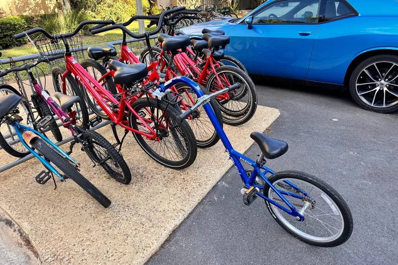 Red Sea Pines Resort rental cruisers and a child’s bike on the rack outside the bicycle shop