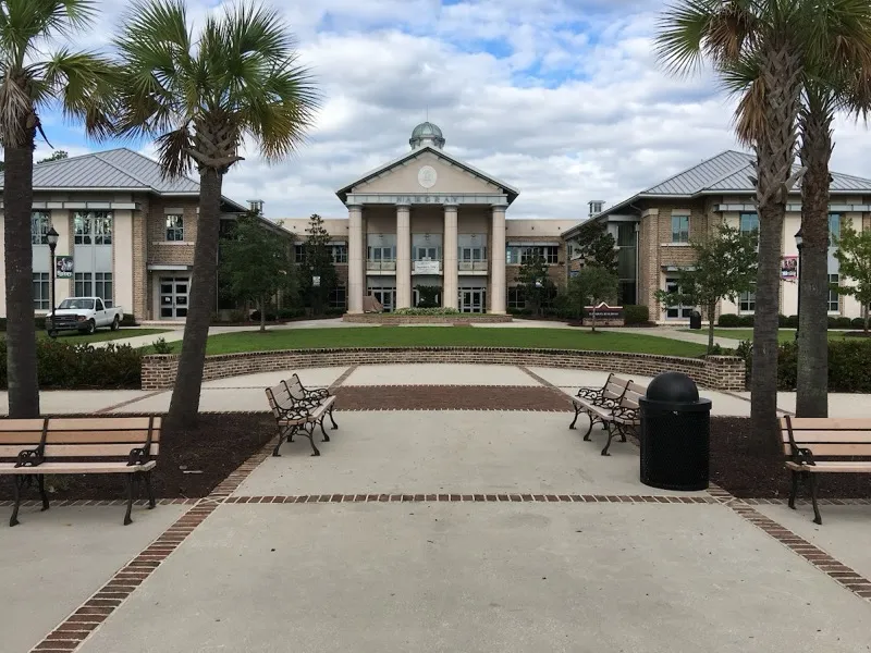 The main building and palm trees at the USC Beaufort Hilton Head Gateway campus in Bluffton, where Cars and Coffee meets