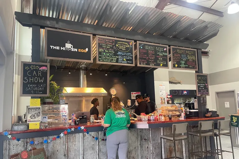 The counter at The Hidden Egg in Okatie, with menu boards and a chalkboard announcing its car show on the last Saturday