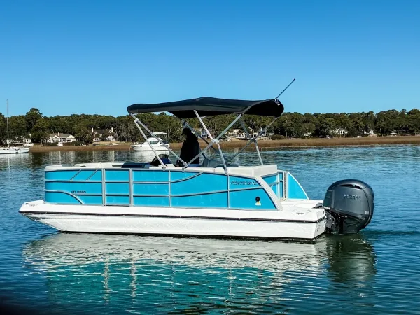 A Carefree Boat Club pontoon boat on the water