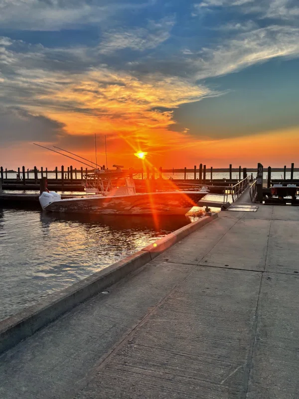 Sunset over the docks at Broad Creek Marina, home of Hilton Head by Boat