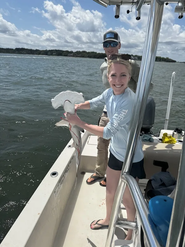 A young angler fishing from a Hilton Head Inshore Charters boat