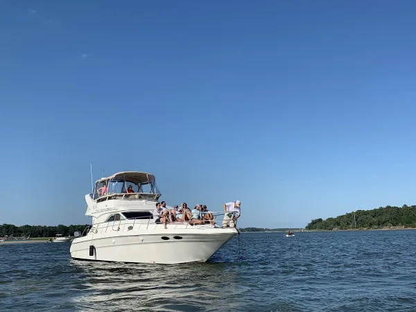 The Over Yonder Charters yacht cruising with guests on deck
