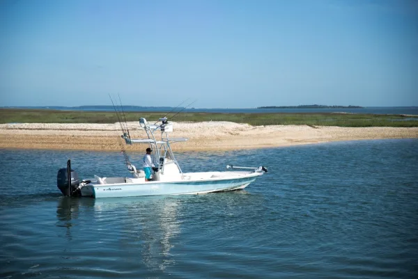The Payback fishing boat anchored off a sandbar