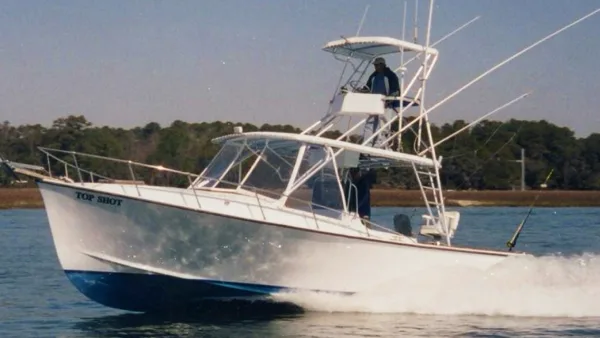 The Top Shot Sport Fishing boat running at speed
