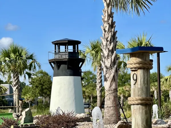 The red-and-white striped lighthouse at Lighthouse Lagoon Miniature Golf in Bluffton