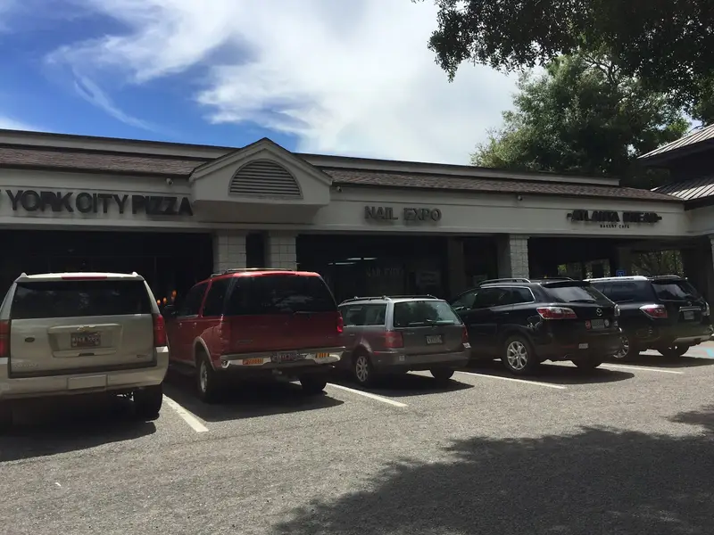 Storefronts for New York City Pizza and Nail Expo along the parking lot at Festival Centre, Hilton Head Island