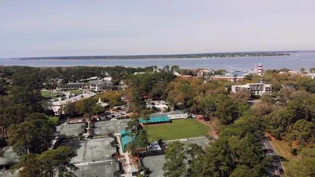 An aerial view of the Sea Pines Racquet Club courts and the Harbour Town Lighthouse