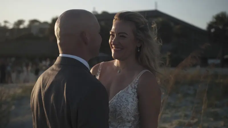 A bride and groom in the evening light by the dunes on a Hilton Head beach